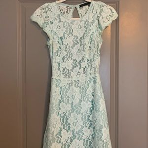 Woman’s size small powder blue lace dress with open back